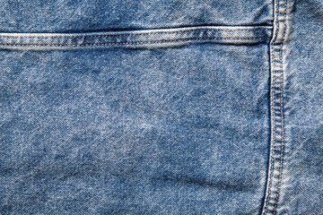 texture of blue jeans denim fabric with seam background	
