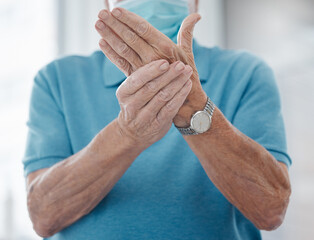 Senior man, hands and joint pain or hurt in hospital, arthritis and osteoporosis or strain. Elderly...
