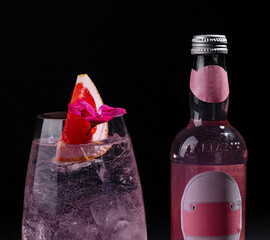 Refreshing pink gin tonic with grapefruit garnish