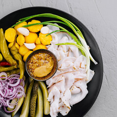 Gourmet cold cut or lard platter with pickles and mustard