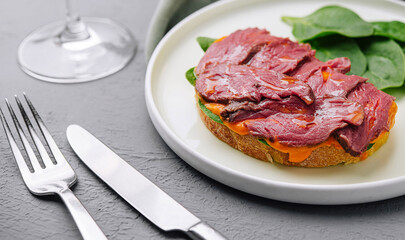 Gourmet beef tenderloin on toast with spinach