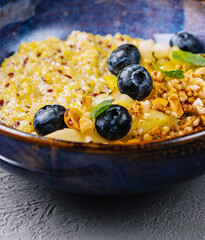 Healthy quinoa breakfast bowl with blueberries