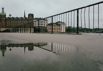 Fototapeta premium View of a railing in front of buildings
