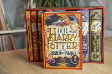 Naklejka premium complete colorful collection paper books by JK Rowling about Harry Potter, appealing to book lovers, especially fans children's literature and fantasy, Frankfurt - December 22, 2023