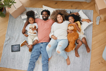 Family, portrait and hug on living room floor in new home for entertainment, bonding and playing...