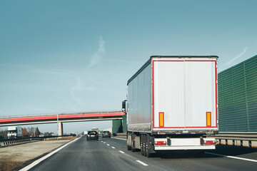 European Semi-Trailer Truck Hauling Goods on a Highway Road