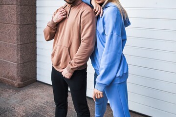 Woman and Man wear a sweatshirt hoodie. Isolated close-up of streetwear apparel. Hoodies mockup.