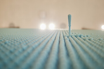 Blue Acupressure Mat-Close-up of a unique blue acupuncture mat with plastic spikes