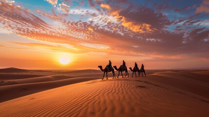 Beautiful caravan of camels as they trek through vast sandy desert beneath a stunning clear blue sky