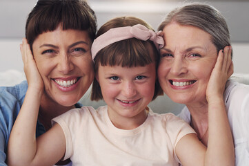 Portrait, grandmother and family with hug on couch for love, support and care in lounge on holiday....