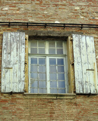 Old windows of a historical building in medieval european city