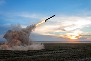 Launching a rocket from a rocket launcher in the fields. Concept: war in Ukraine, missile attack,...