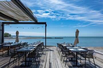 terrasse de restaurant au bord de mer havre de paix confortable avec vue imprenable photographie darchitecture - obrazy, fototapety, plakaty
