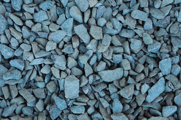 Granite gravel chips materials for the construction. Natural crushed granite gravel as a background. Industrial design