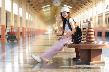 Asia woman travelers feel happiness before traveling at the train station, Travel, and lifestyle...