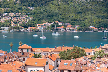 View from height of red roofs of bay with beautiful blue sea and boats. Landscape of Mediterranean city