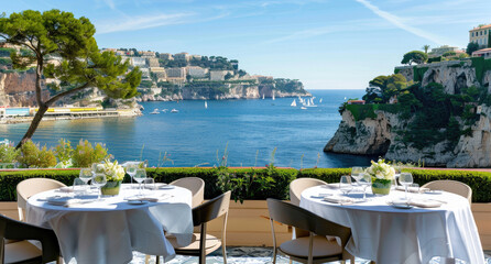 Dining tables were set up on the terrace of an elegant restaurant with a sea view in Monaco,...