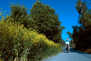 person on a bicyclepath in the summerpark, nacka,sverige,sweden,stockholm,Mats