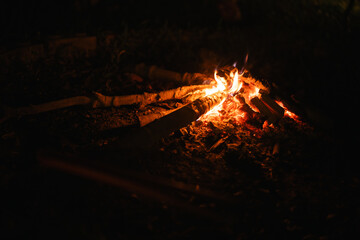 Close up of Small campfire with gentle flames at night time, fire or flame heat. Warm, explore,...