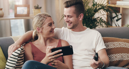 Couple, happy and cellphone for live streaming, video call and connection in home for relax. Man, woman and smile on couch for communication, email and influencer for social media or blog on sofa