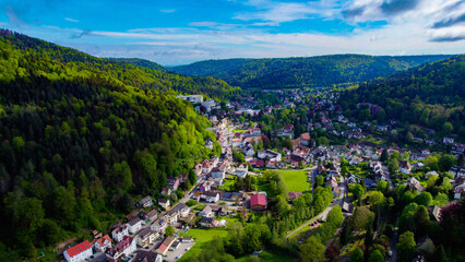 Aerial around the old town of Bad Herrenalb in the black forest  on a sunny day in spring