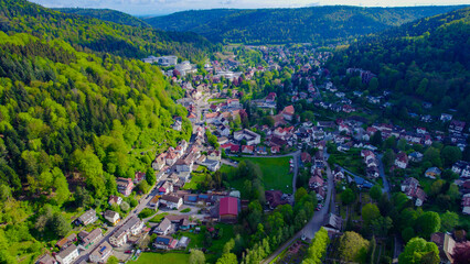Aerial around the old town of Bad Herrenalb in the black forest  on a sunny day in spring