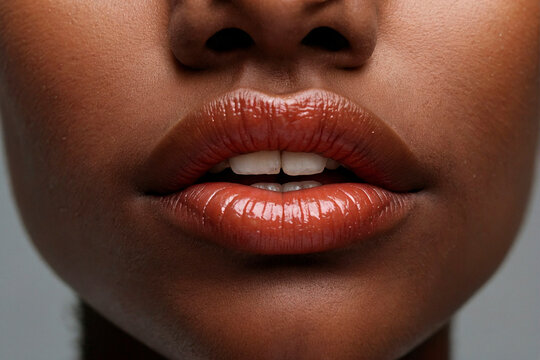 Close-up of a young african woman's face, puckering lips for a kiss