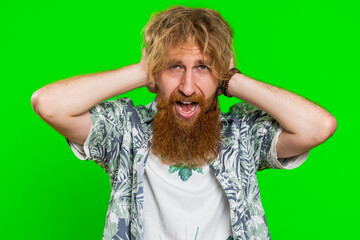 Dont want to hear, listen, quiet. Frustrated annoyed irritated man covering ears gesturing no, avoiding advice ignoring unpleasant noise loud voices. Redhead guy isolated on chroma key background
