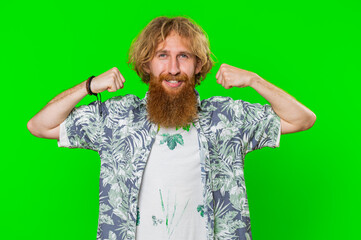 I am strong and independent. Young bearded man showing biceps and looking confident, feeling power strength to fight for rights, energy to gain success win. Guy isolated on green chroma key background