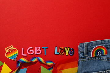 LGBT parade concept, colorful symbols on red background.