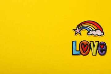 LGBT parade concept, free love symbol on yellow background.