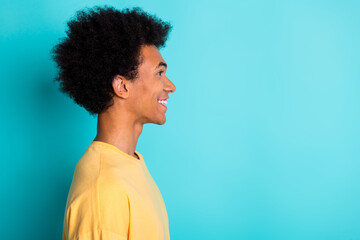 Side profile photo of cheerful man with afro hairstyle wear oversize t-shirt look at promo empty...