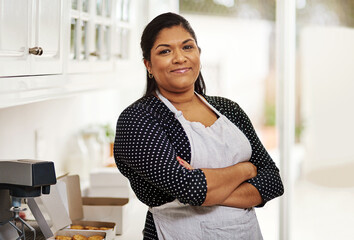 Woman, portrait and apron with pride in kitchen for small business, startup bakery and happiness...