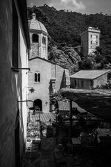 Magic of Liguria. Timeless images. Ancient abbey of San Fruttuoso, bay and historic building guarded by the FAI. Italian Environmental Fund. Black and white.