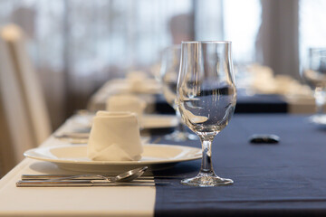 A table with a glass and a napkin on it