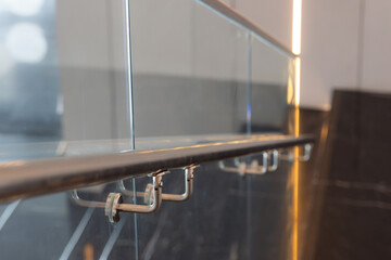 A railing with a glass panel in the middle