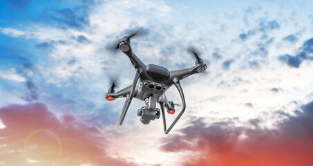 A black modern drone with a camera flies in the sky.