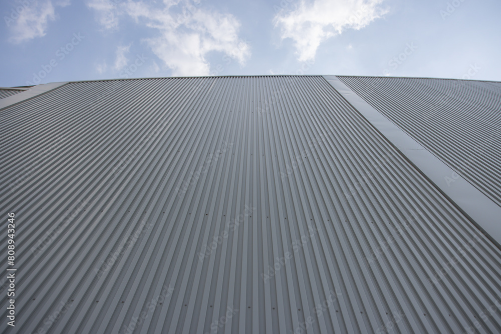 Wall mural the roof of a cargo building is covered in metal