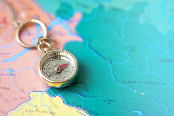 Сlose-up of a Compass On A Map. Travel Concept