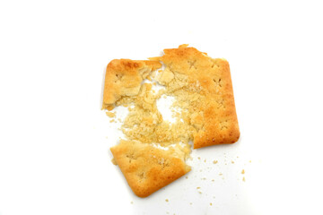 crushed malkist crackers on a white background