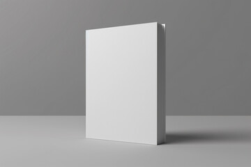 a blank book on a table with a gray background