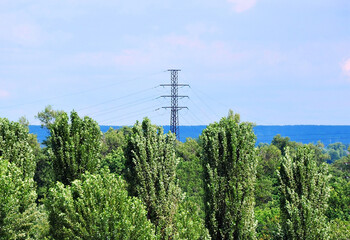 Suburban high voltage transmission line over forest in Ukraine