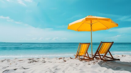 Two beach chairs and a umbrella on the white sand on a sunny day, with a blue sea in the background. A summer vacation concept banner with copy space for text