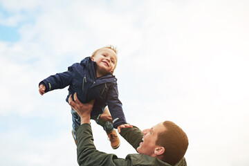 Father, child and playing together with sky, happy laugh and bonding on outdoor adventure. Dad, son...