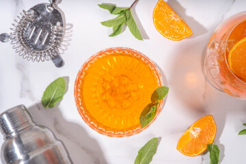 Classic italian aperitif aperol spritz martini cocktail in glass with ice cubes, alcohol sweet long...