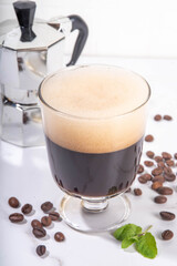 Rich Coffee boozy cocktail with strong espresso coffee, sweet liquor,  creme de cacao, pistachio...