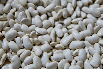 pile of White beans or navy beans for sale at a market in Salta, Argentina. healthy dried legume