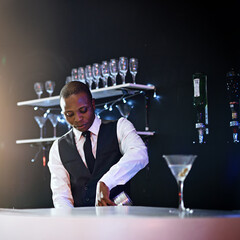 Black man, bartender and mix drink in restaurant, hospitality and counter server for alcohol. Male...