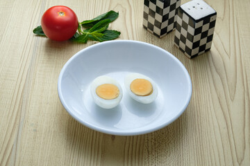 A plate of boiled eggs, cut in half