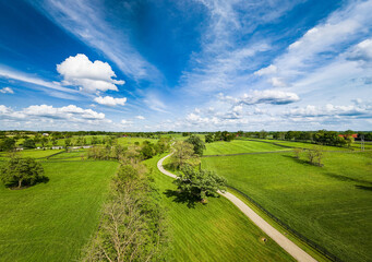 Aerial view of agricultural fields and horse pastures in rural Kentucky - Powered by Adobe
